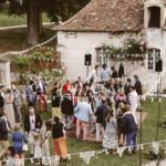 exterior view of a wedding in the courtyard of La Leotardie