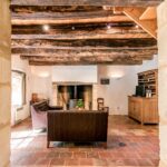 living room with sofas, the fireplace and other furniture on a authenic tile floor